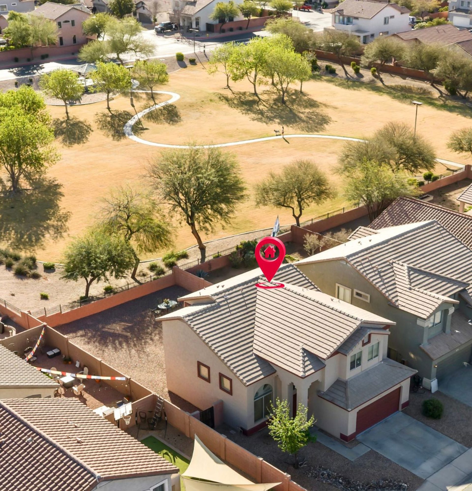 Aerial drone view of 845 S Cerise in Mesa, AZ, marked with a red location pin. The home is situated on a premium lot in the gated La Fortina community, backing directly onto a large grassy park with walking paths and mature trees.